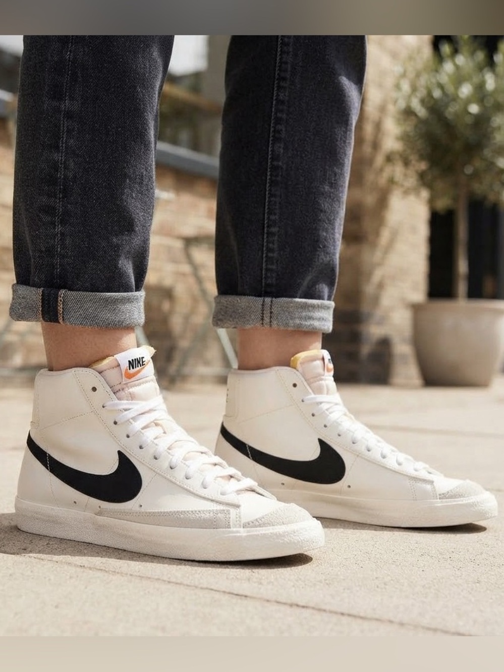 Nike White High-Top Sneakers with Black Swoosh
